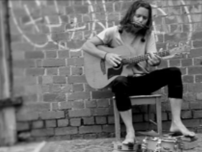 Boy playing a guitar